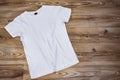 T-shirt mockup and template on wood background for fashion and graphic designer Royalty Free Stock Photo