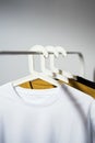 T-shirts displayed on clothes rack