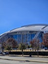 AT and T Stadium surrounded by trees and plants at sunset in Arlington Texas Royalty Free Stock Photo