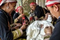 Red Dao women sewing in the village.