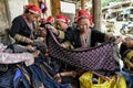 Red Dao women sewing in the village.