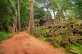 Ta Prohm, part of ancient Khmer temple complex in jungle.