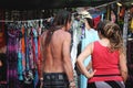 Ta`Qali, Malta - June 04 2022: A new-age hippy couple shopping for clothes at a festival market stall