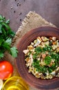 Tabbouleh - hot salad of couscous, meat, fried vegetables and parsley