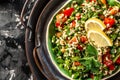 Tabbouleh salad closeup, Part of middle eastern meze. Top view