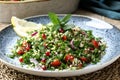 Tabbouleh salad onion tomato and parsley in ceramic dish Royalty Free Stock Photo