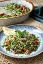 Tabbouleh salad onion tomato and parsley in ceramic dish Royalty Free Stock Photo