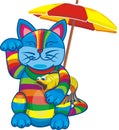 Tabby cat with a fish in its paws under an umbrella Royalty Free Stock Photo