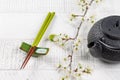 Table adorned with cherry blossom branch and chopsticks Royalty Free Stock Photo