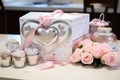 A table adorned with a delightful box of cupcakes and vibrant flowers, creating a charming setting for a joyous occasion., White,