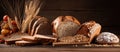 A variety of bread and wheat ingredients laid out on a wooden table Royalty Free Stock Photo