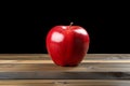 Table adornment artificial red apple stands out on a wooden surface Royalty Free Stock Photo