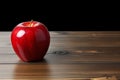 Table adornment artificial red apple stands out on a wooden surface Royalty Free Stock Photo