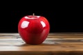 Table adornment artificial red apple stands out on a wooden surface Royalty Free Stock Photo