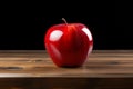 Table adornment artificial red apple stands out on a wooden surface Royalty Free Stock Photo