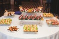 Table with assortment of canapes snacks. Banquet service.
