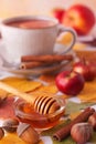 Table with autumn decoration theme, tea, honey, fruit and nuts. Royalty Free Stock Photo