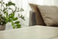 Table background with copy space for products. Home interior and bright window and sofa background Royalty Free Stock Photo