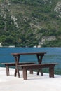 Table and benches on the pier of Kotor Bay. Montenegro