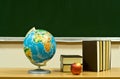 Table with books and apple Royalty Free Stock Photo