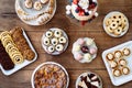 Table with cake, pie, cupcakes, cookies, tarts and cakepops