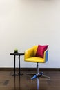 Table Chair combination in front of a plain wall Royalty Free Stock Photo