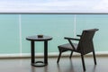 Table and chair with outdoor balcony and sea .The chair and table on balcony sea view. Chair with table set on balcony hotel room Royalty Free Stock Photo