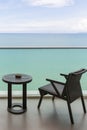 Table and chair with outdoor balcony and sea .The chair and table on balcony sea view. Chair with table set on balcony hotel room Royalty Free Stock Photo