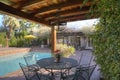 Table and chair at poolside in mansion Royalty Free Stock Photo