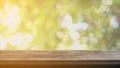 Table and Chair, Wood table bar and nature tree bokeh blurred background at morning time and beautiful nature sun light, Top wood Royalty Free Stock Photo