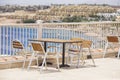 Table and chairs in beach cafe next to the red sea in Sharm el Sheikh, Egypt Royalty Free Stock Photo