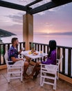 Table and chairs with breakfast during sunrise at the meditarian sea in Greece Royalty Free Stock Photo