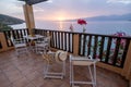 Table and chairs with breakfast during sunrise at the meditarian sea in Greece Royalty Free Stock Photo