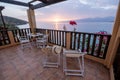 Table and chairs with breakfast during sunrise at the meditarian sea in Greece Royalty Free Stock Photo