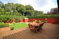 Table and chairs on decking at the back garden