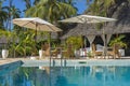 Table and chairs in empty cafe next to the swimming pool at island Zanzibar, Tanzania Royalty Free Stock Photo