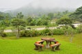 Table and chairs on a lawn at the garden Royalty Free Stock Photo