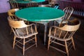Table and chairs in an old fashioned gambling hall parlour, abandoned