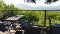 Table and chairs of one of the street restaurants with a beautiful view of the fields and mountains. Romantic meeting and outdoor