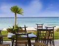 Table and chairs in restaurant on tropical beach Royalty Free Stock Photo