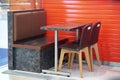 Table and chairs and sofa in fast food shop