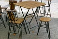 Table and chairs stand on the street on the sidewalk in the summer cafe Royalty Free Stock Photo