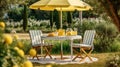 Table, chairs and umbrella outdoors in garden. Summer spring picnic concept Royalty Free Stock Photo