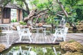 Table and chairs white made of metal in a garden cafe. Royalty Free Stock Photo