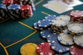 a table with chips on top of it with cards scattered next to it