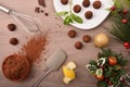 Table with chocolate truffles in preparation with Christmas decoration top