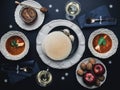 Table with Christmas dinner for two. Fish soup and white wine Royalty Free Stock Photo