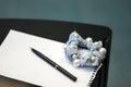 A table in the classroom with a piece of paper, a pen, and a women`s hair accessory decorated with artificial pearls. Copy space Royalty Free Stock Photo