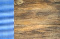 Table cloth blue checkered on wooden board. Royalty Free Stock Photo