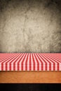 Table cloth, kitchen napkin on wooden background.